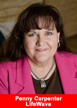 Penny Carpenter, Senior Presidential Director at LifeWave, smiles in a professional headshot wearing a pink blazer.