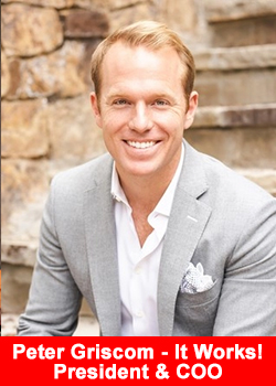 Peter Griscom smiling in a light gray suit, seated on outdoor stone steps, newly appointed President and COO of ItWorks!